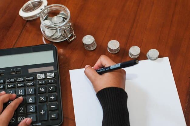 A close-up of a hand using a calculator to determine debt settlement amounts, with various financial documents and a pen scattered around.